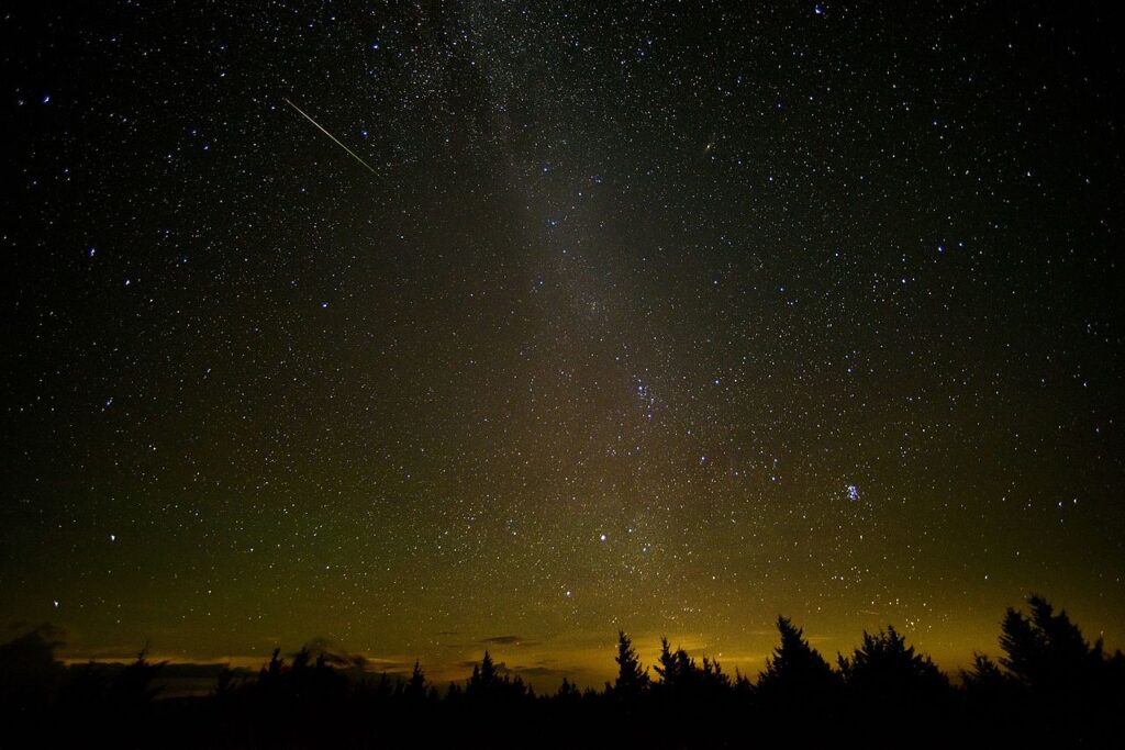 In this 30-second exposure, a meteor streaks across the sky during the annual Perseid meteor shower Friday, Aug. 12, 2016 in Spruce Knob, West Virginia.